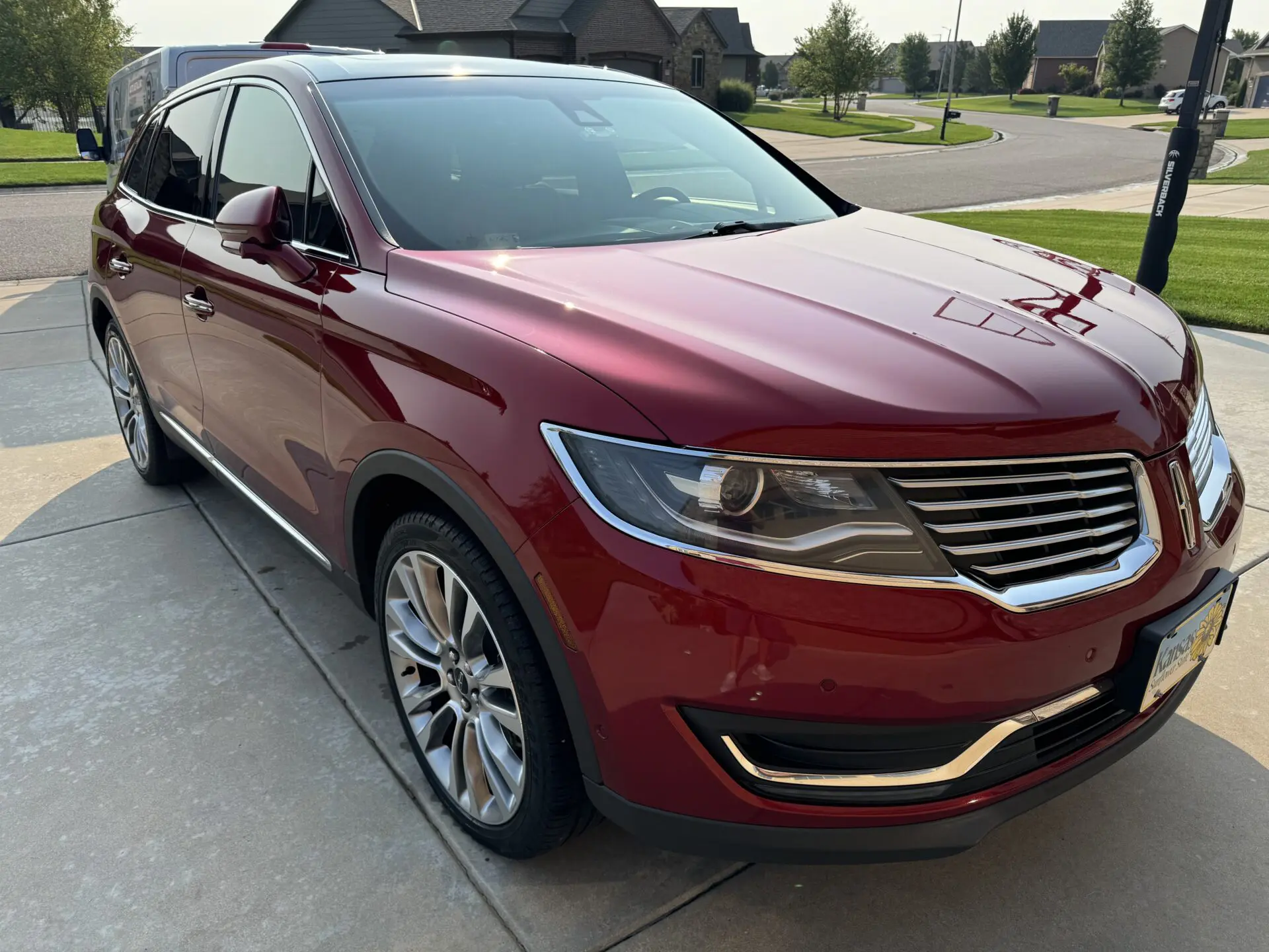 Glossy red Lincoln SUV after ceramic coating in Wichita, KS
