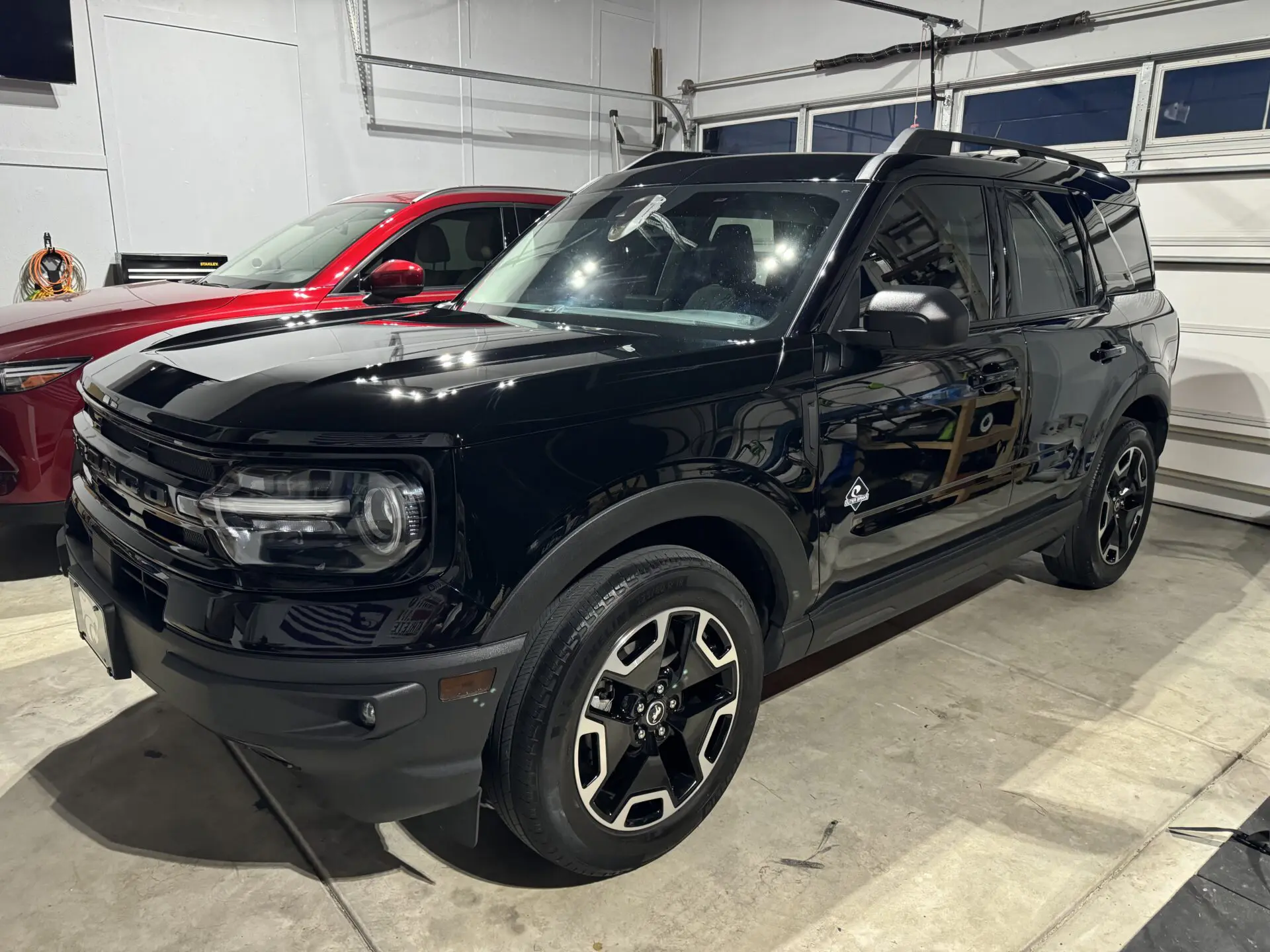 Black Ford Bronco with a glossy protected finish after detailing